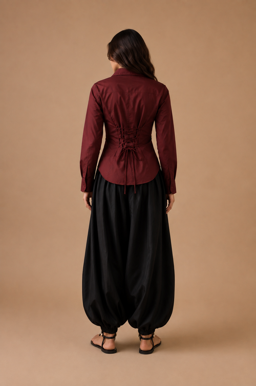 Burgundy shirt with black balloon pajama, back view