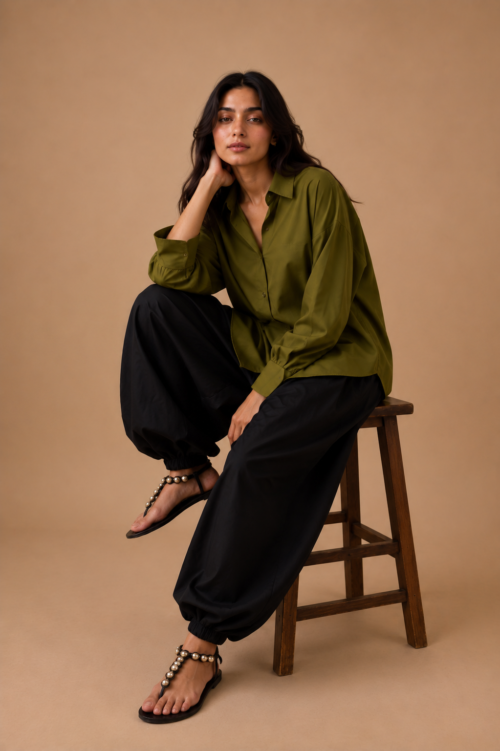 Olive relaxed shirt with black balloon pajama, seated styling